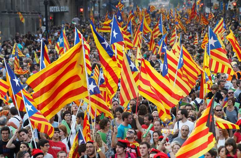 Patriotic Catalans waving their flag