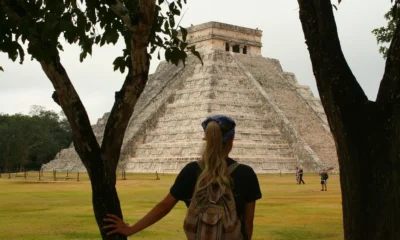 A backpacker visiting Chichén Itzá in Mexico