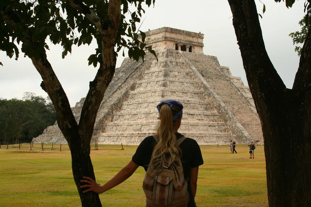 A backpacker visiting Chichén Itzá in Mexico