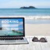 Laptop on the beach - travel deals