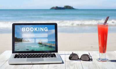 Laptop on the beach - travel deals