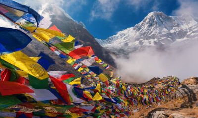 Nepal travel mountains with Buddist flags